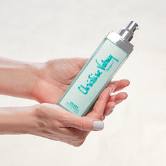 Christine Valmy's all-natural Valeen: Mild Astringent being held vertically by hands