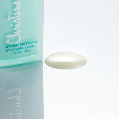 Christine Valmy's all-natural Wrinkle Softening Serum's texture is shown to the right of the product