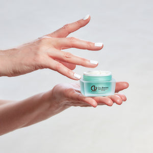 Cell Renewal Cream being held by hands