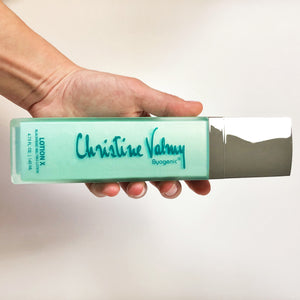 Christine Valmy's all-natural Lotion X: Blackhead Melting Lotion held horizontally by a hand