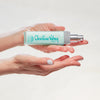 Christine Valmy's all-natural Special Lotion #22: Daytime Protection & Moisturizing Lotion held horizontally by hands