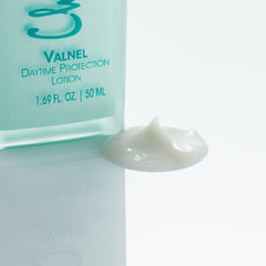 Christine Valmy's all-natural Valnel: Daytime Protection & Moisturizing Lotion’s texture is shown to the right of the product 