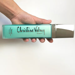 Christine Valmy's all-natural Valpure: Gentle Wash-off Cleanser being held horizontally by hands